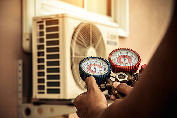 Professional Air Conditioning Service technician working in North Prairie, WI